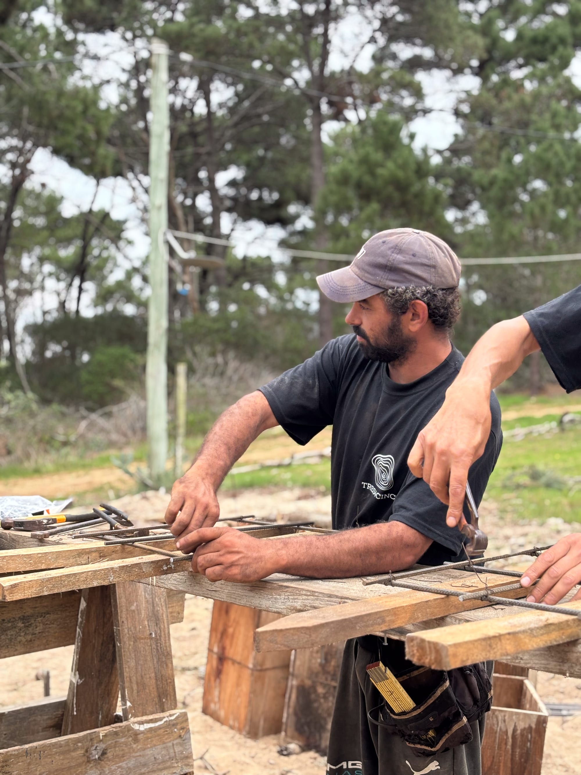 Worker assembling reinforcement by hand